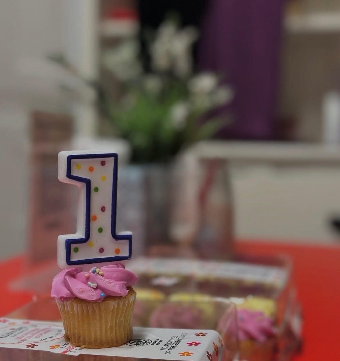 Cupcake with a number one birthday candle